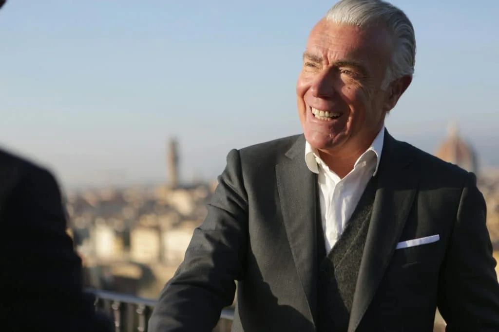 Happy professional smiling in his office